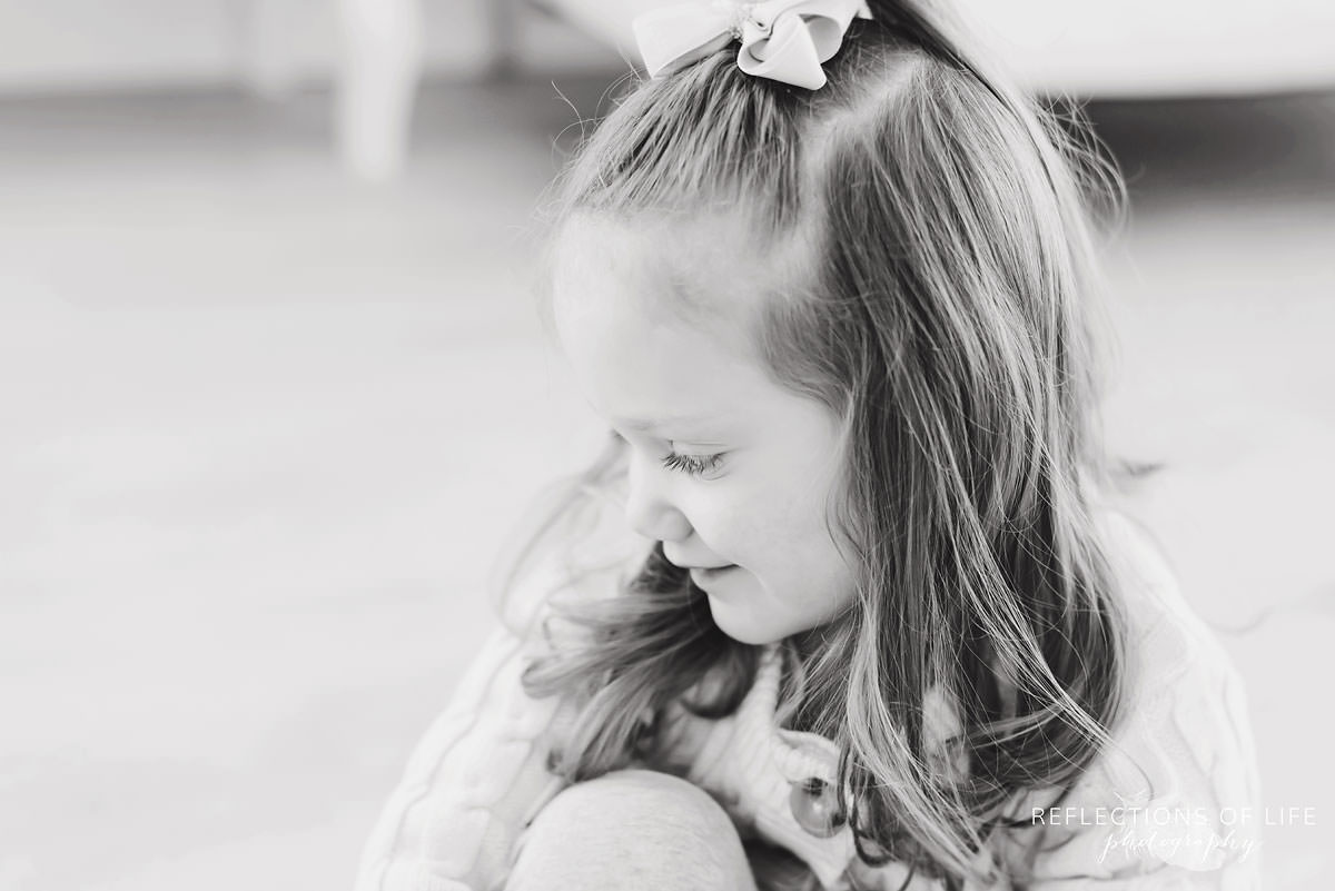 Cute little girl looking away black and white