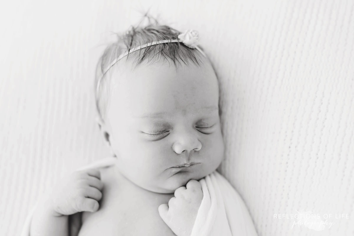 Sleeping baby closeup in black and white