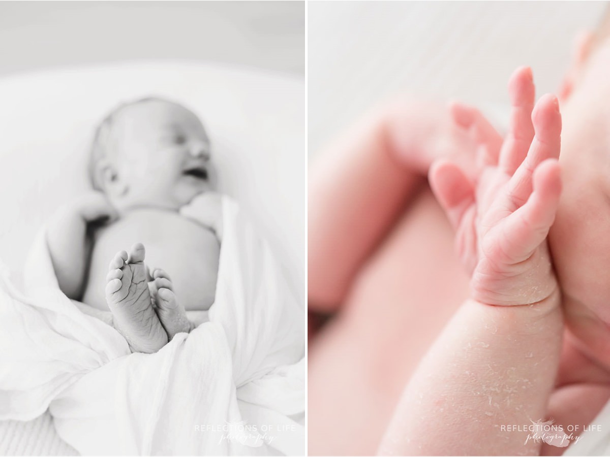 Newborn baby's feet and hands in black and white