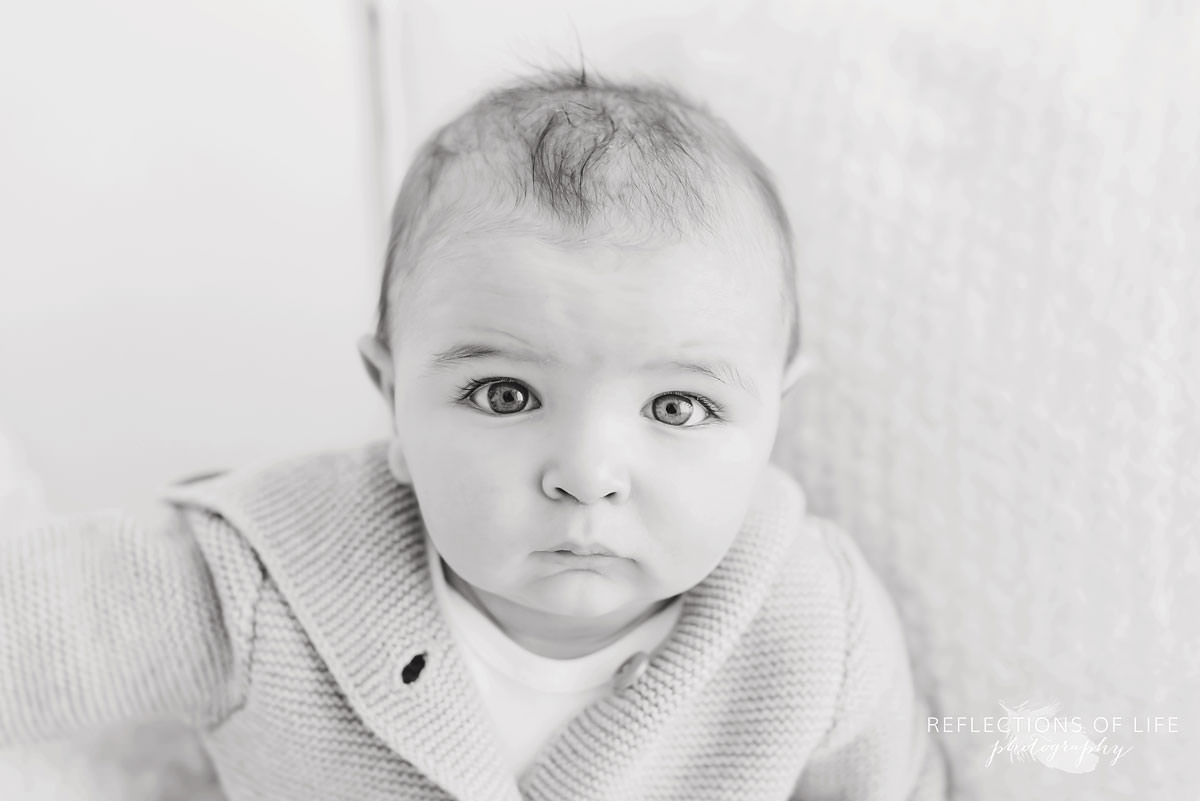 closeup of baby's face in black and white
