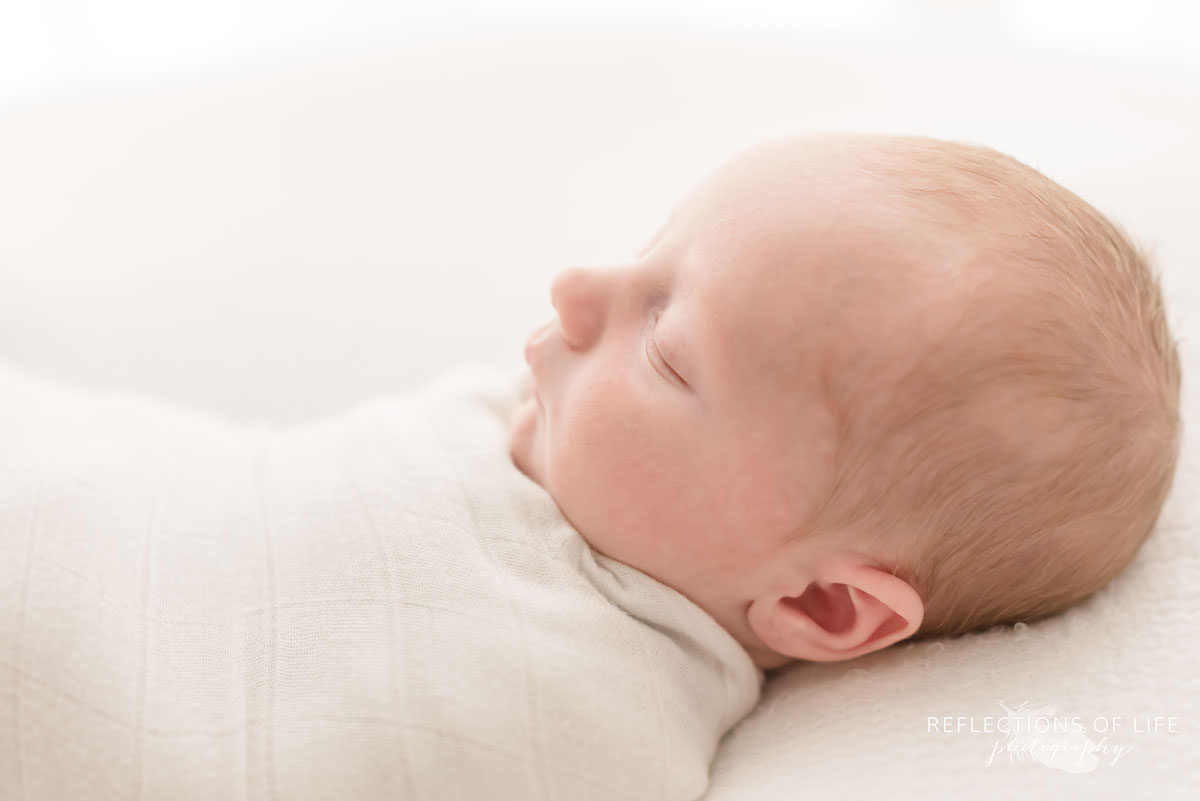 Adorable baby's profile while he sleep in Ontario