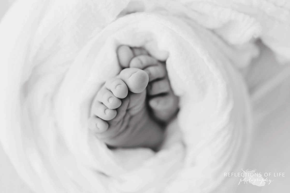 small newborn toes in black and white