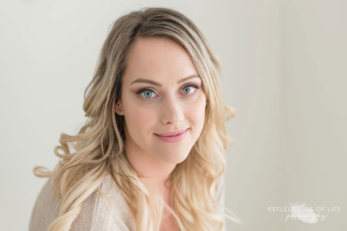 Maxine McLellan gorgeous headshot of young blond mama with long loose curls