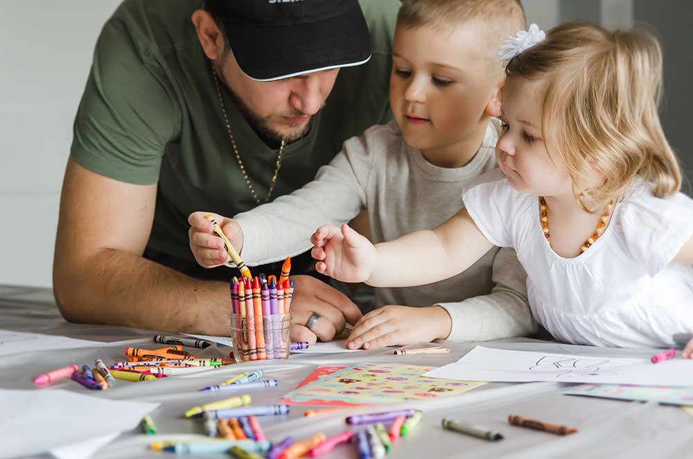 cute kids colour with their dad