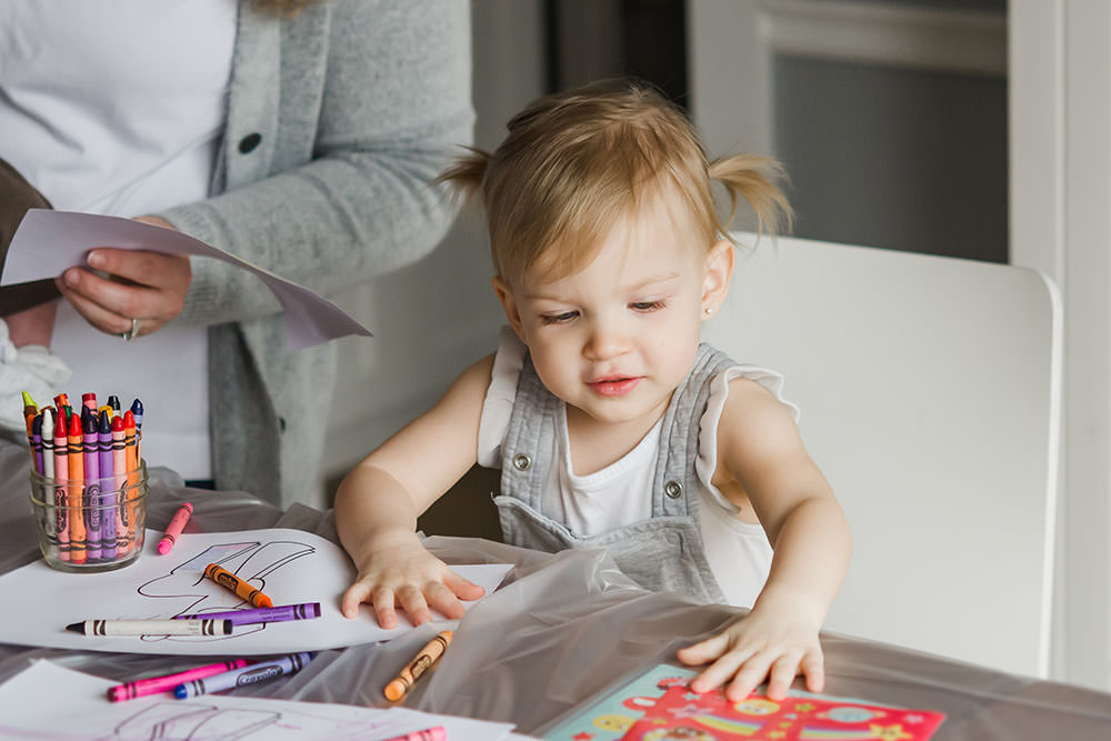 little girl picks a sticker to use