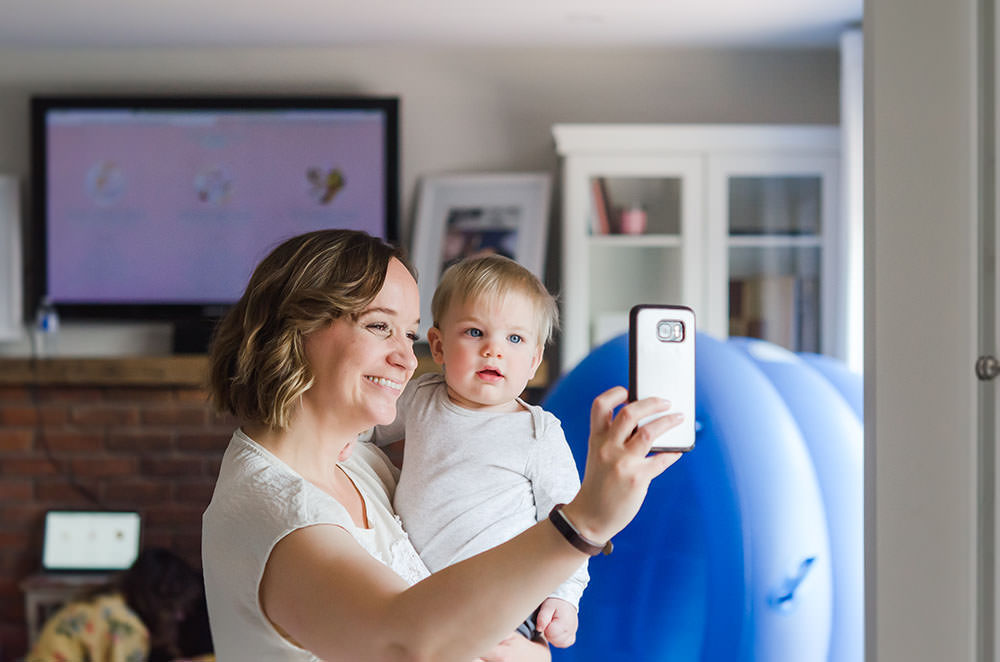 karen takes a selfie with cute little boy