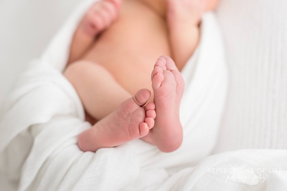 newborn baby feet crossed in grimsby