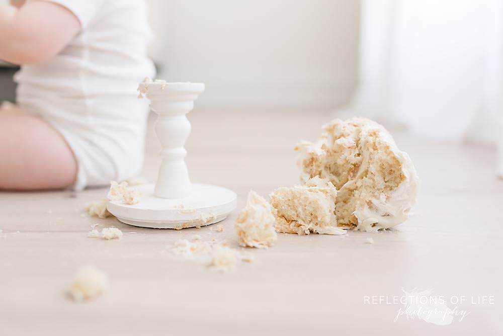 cake that is all over the floor in natural light studio