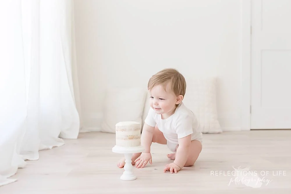 Little boy plays with his cake smash session Niagara.jpg