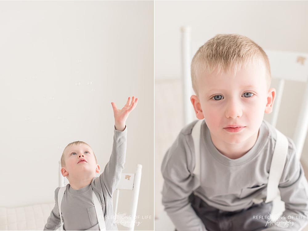 Little boy blowing bubbles Niagara family photography