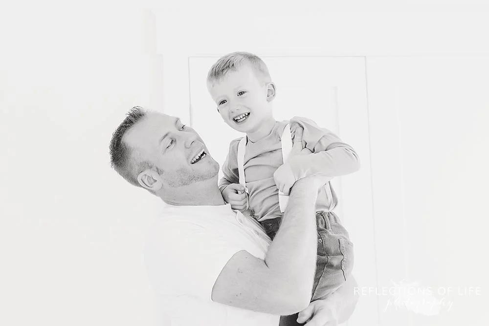 Candid father and son portraits in Grimsby Ontario studio