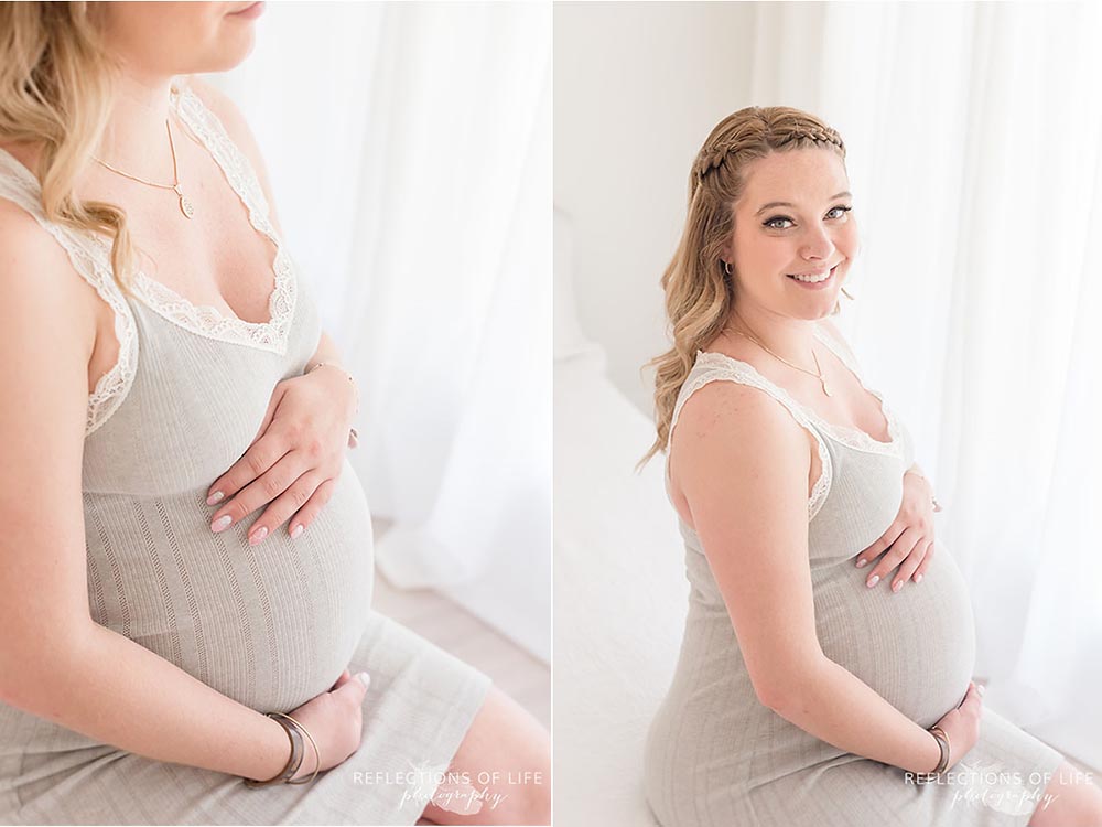 pretty blond mama with long loose curls and hands on her belly
