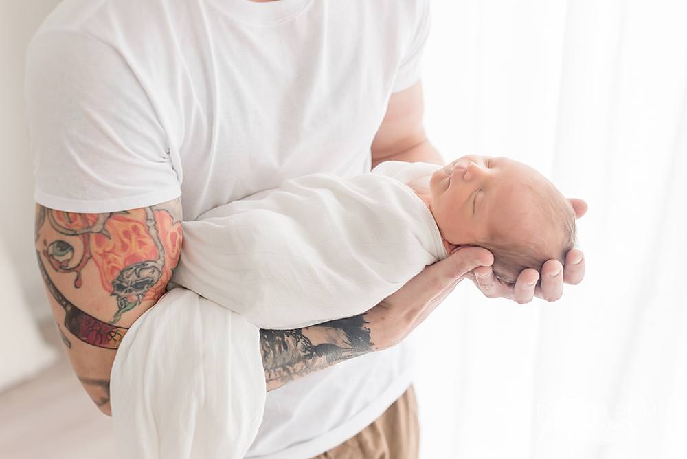 Newborn baby in daddy's arms