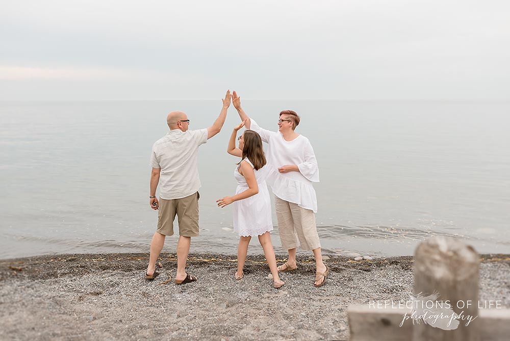 Candid family photos at a beach in Grimsby Ontario