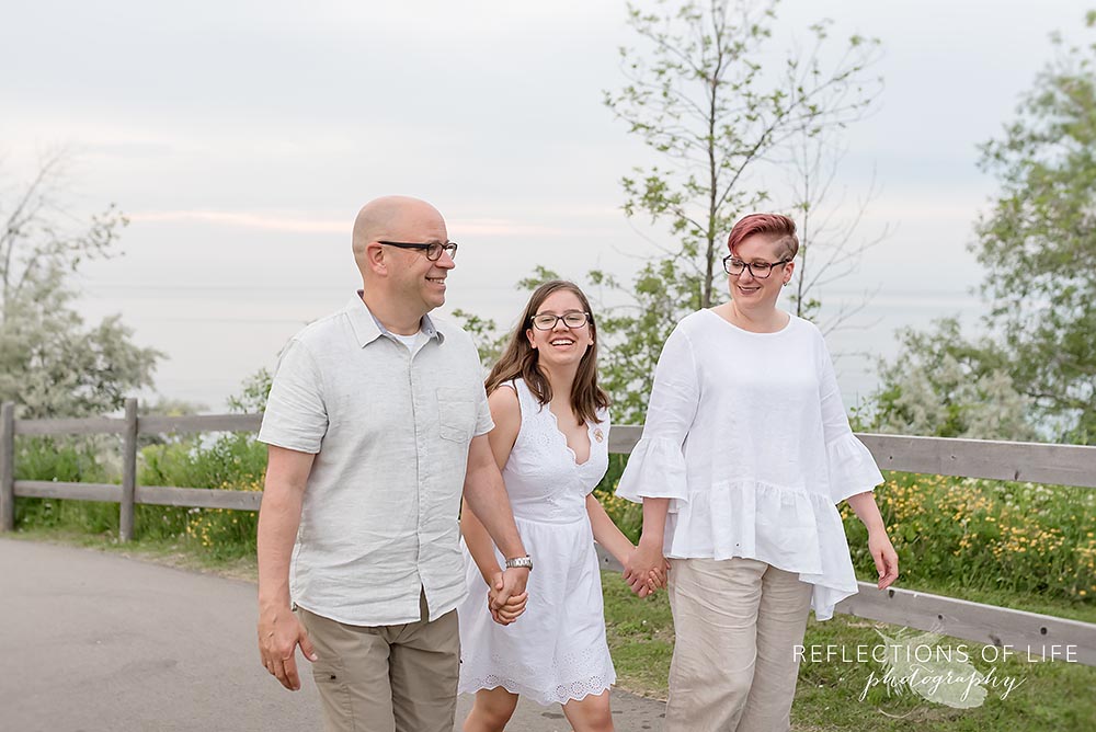 Family walking up the road near the beach in Niagara Region of Ontario