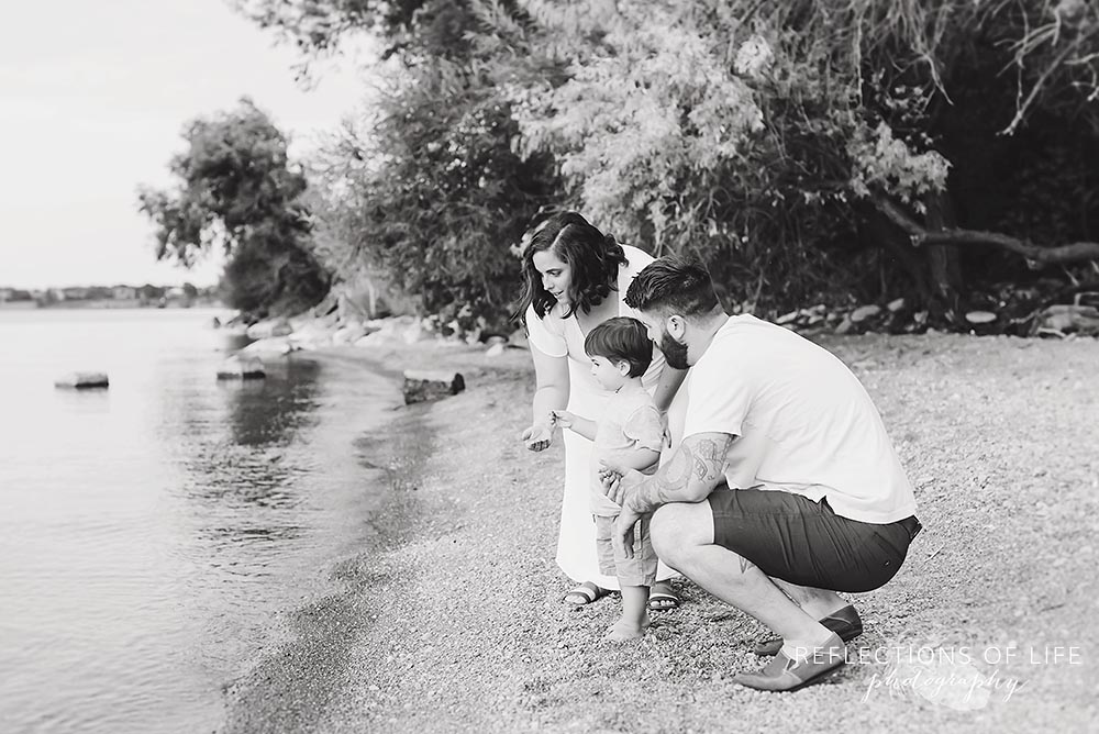 Family throws rocks into Casablanca Beach Grimsby Ontario.jpg