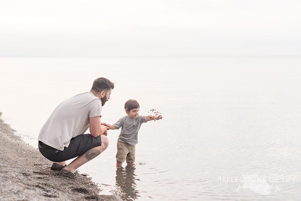 Dad and son play at the beach in Niagara Ontario.jpg