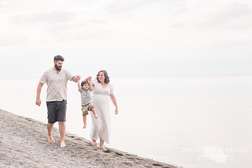 Family plays on the beach in Niagara Ontario Canada.jpg