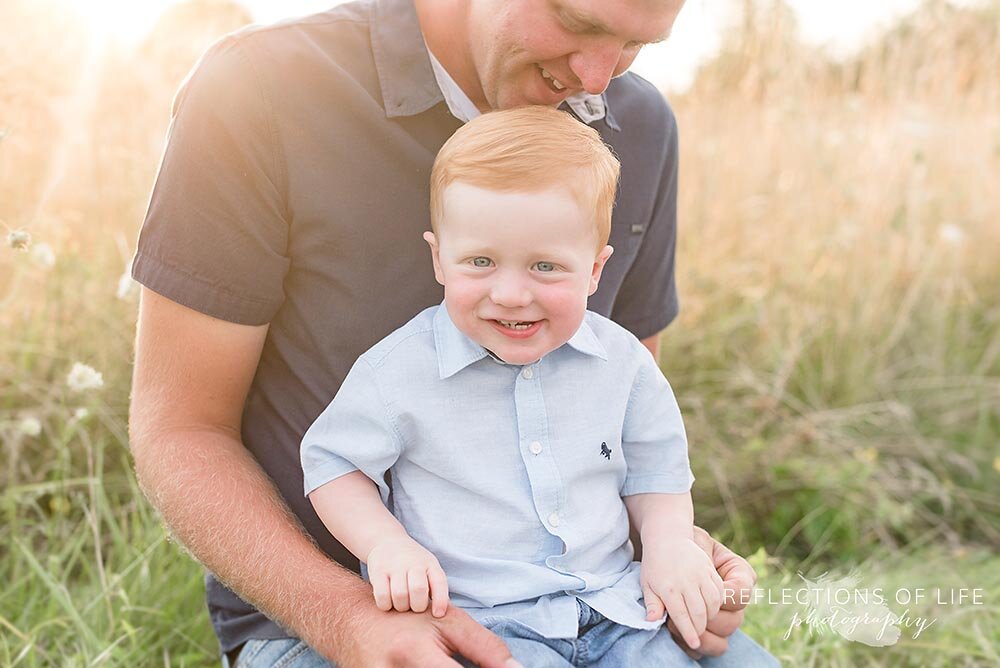 little red haired boy smiling at the camera