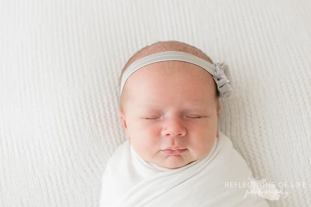Newborn baby girl with gray headband Niagara Ontario.jpg
