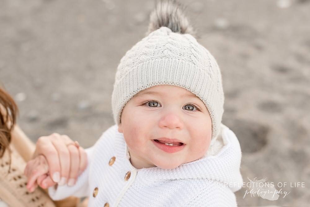 Baby boy smiling at the camera in Niagara Ontario
