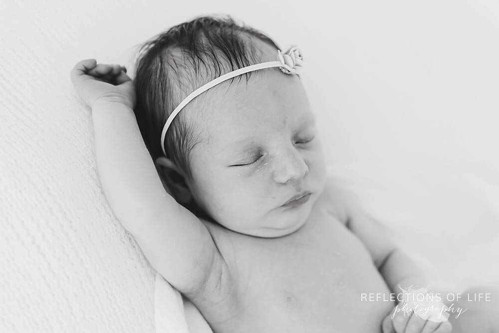 newborn baby girl in wimple pink headband