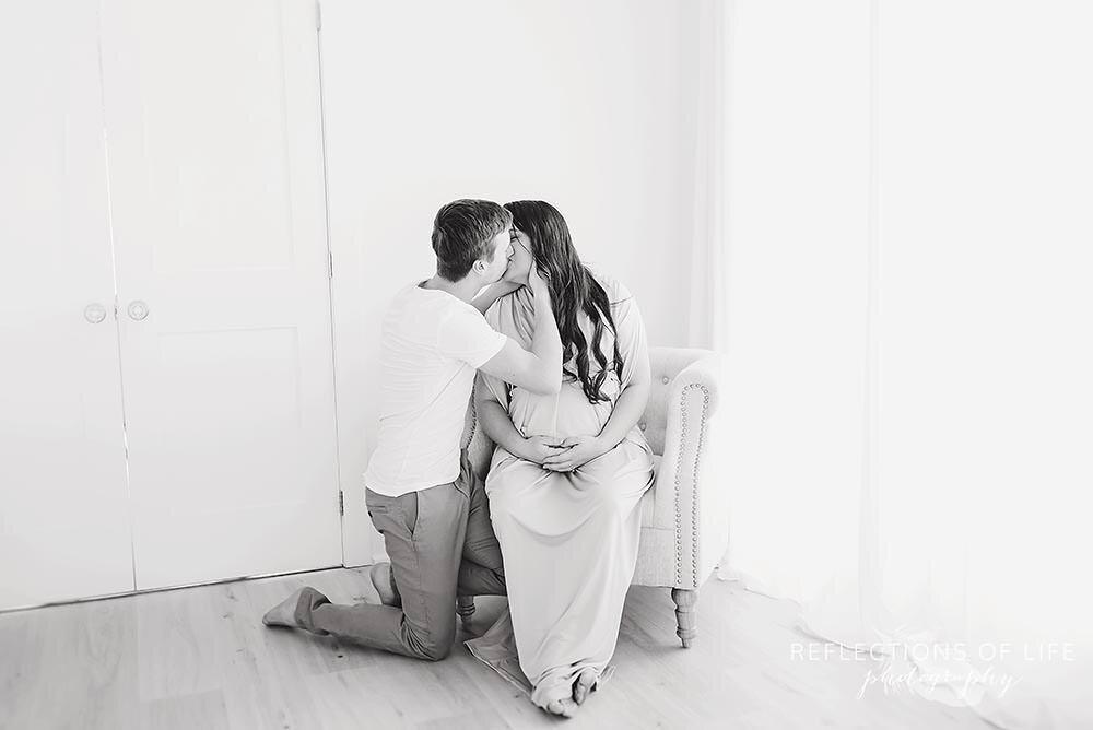 Husband and Wife Kissing with Pregnant Belly Jordan Ontario