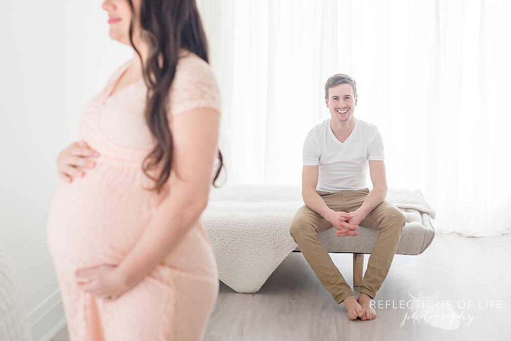 Husband Smiling at Pregnant Wife From Afar St. Catharines Ontario