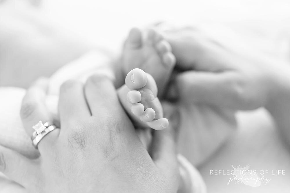 Mama hold her baby boy's feet close up photography with macro lens Niagara Ontario Canada
