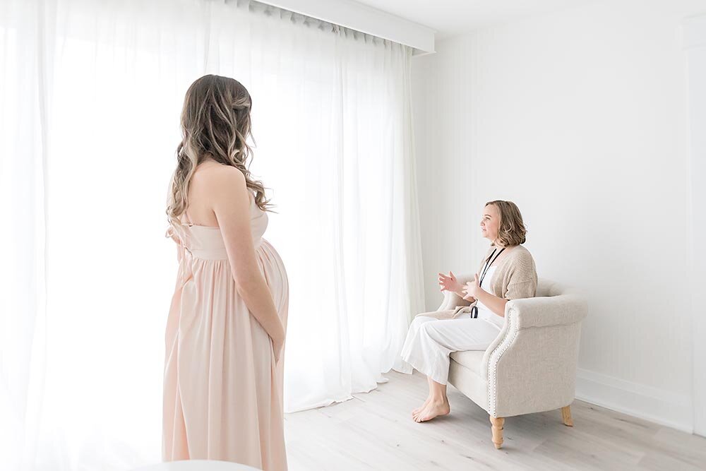 Niagara Ontario Photographer showing pregnant mama how to pose (Copy)