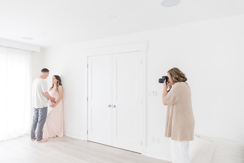 Niagara Ontario photographer behind the scenes of a pregnancy session in natural light studio (Copy)