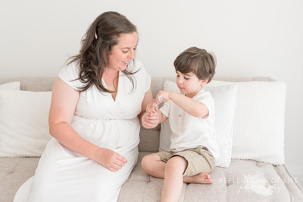 Mama and son blowing bubbles together in pro photo studio Niagara
