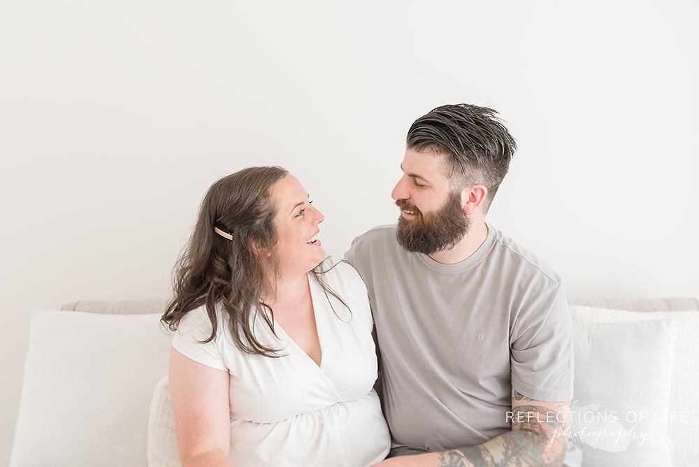 Couple laughing together in Burlington Photo Studio