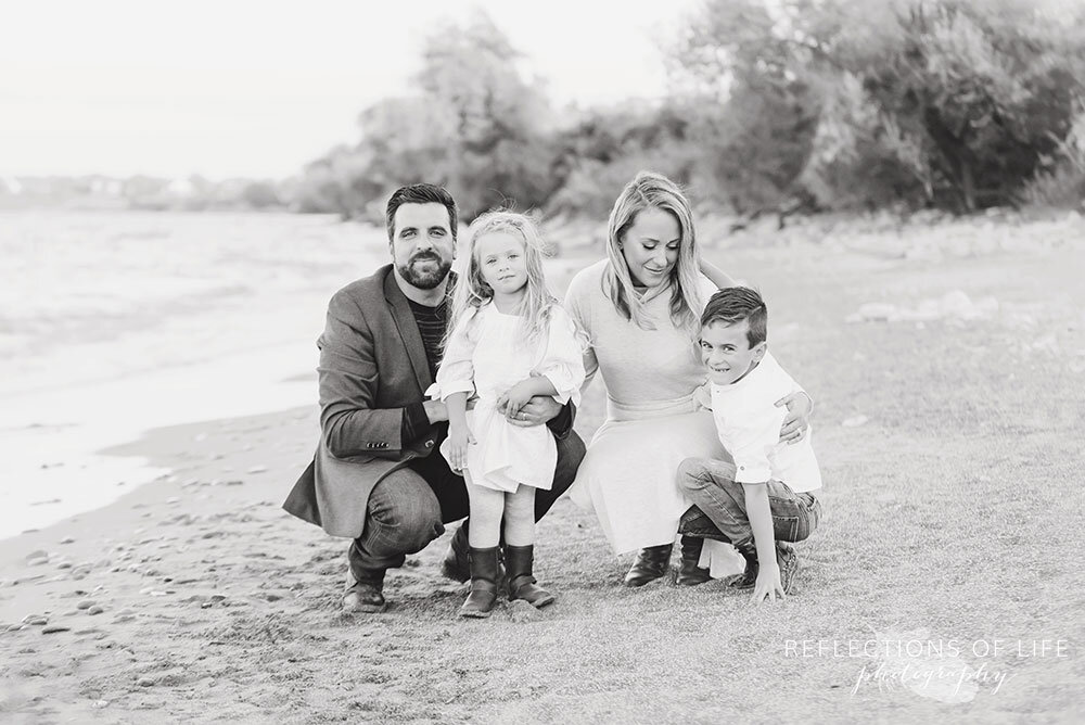 Super sweet family posing at the beach in black and white Grimsby Ontario