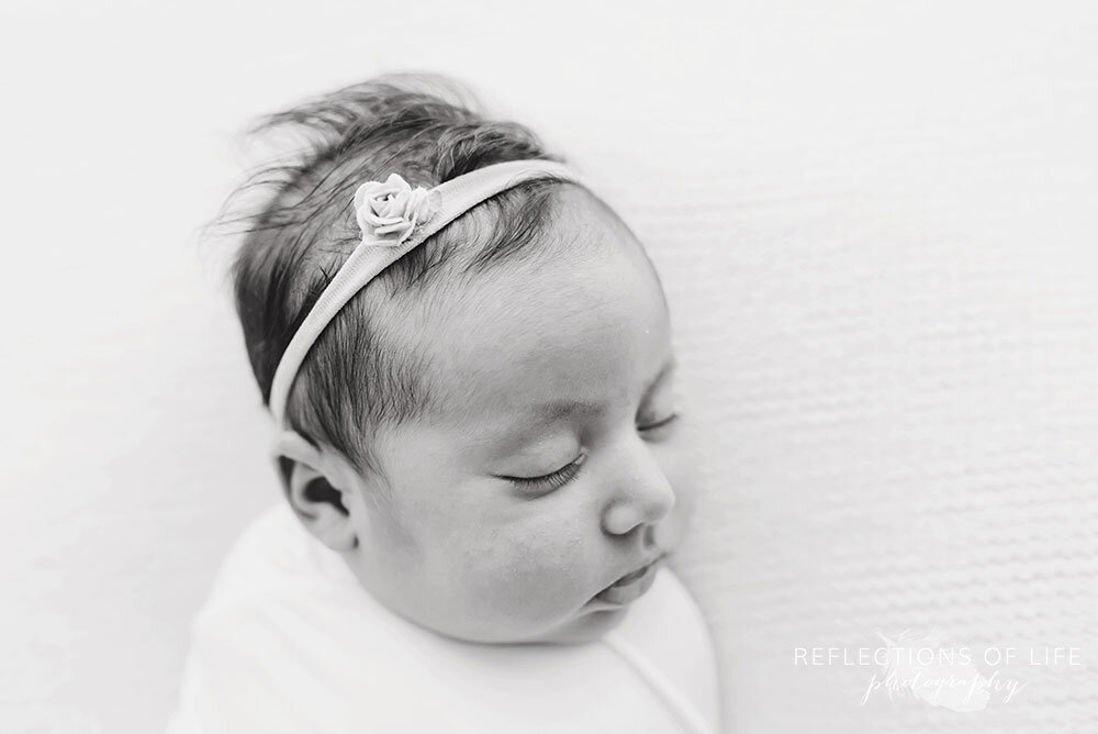Black and white side profile of newborn baby girl Grimsby Ontario Photo Studio