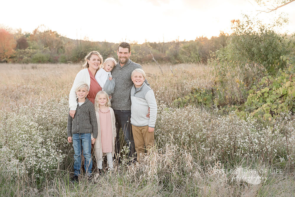 Family photography in a field in Grimsby Ontario