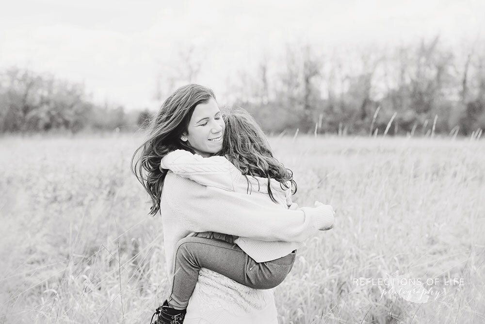 Mother hugging her daughter in Niagara Region Family Photoshoot