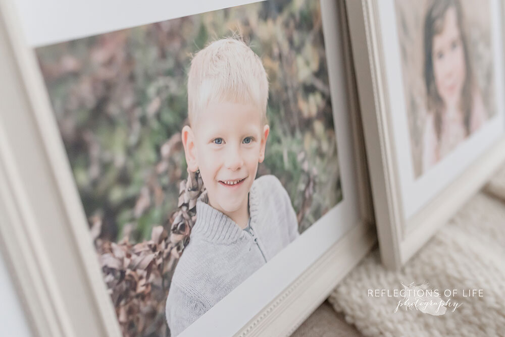 Adorable photos of little boy framed in off white beaded custom frame Niagara Ontario