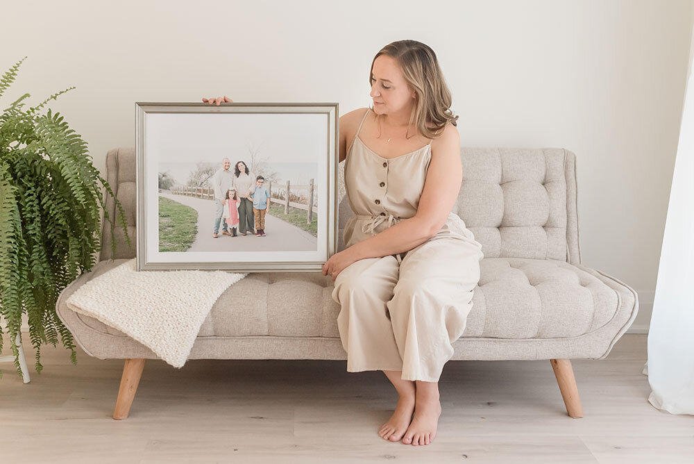 Grimsby Ontario professional photographer Karen Byker shows off recent family photo deep matte framed in metallic silver