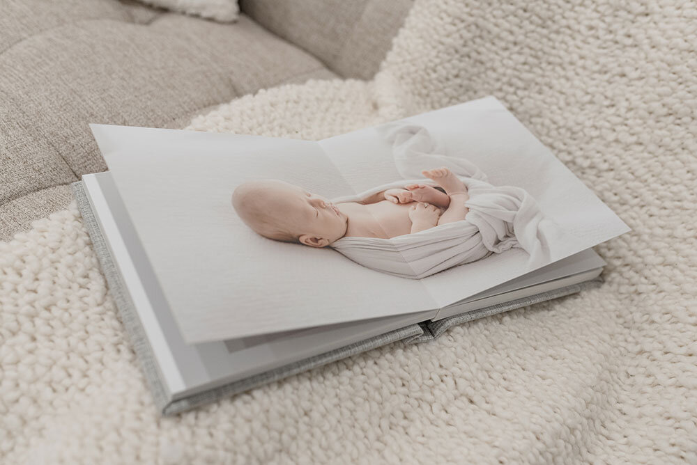 Hamilton newborn and family photographer specializing in albums for clients in the southern Ontario