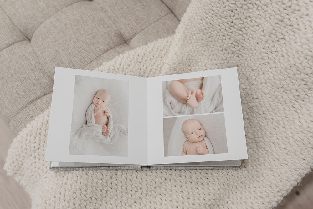 Newborn and family photographer specializing in albums for clients in Niagara Region