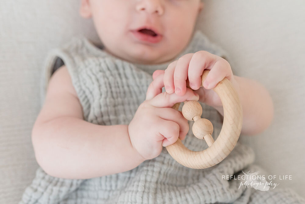 Wooden baby toy at family photography session Niagara