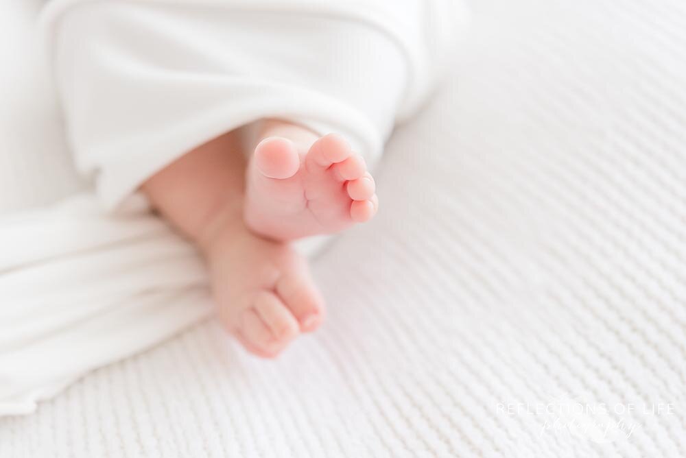 newborn swaddled feet