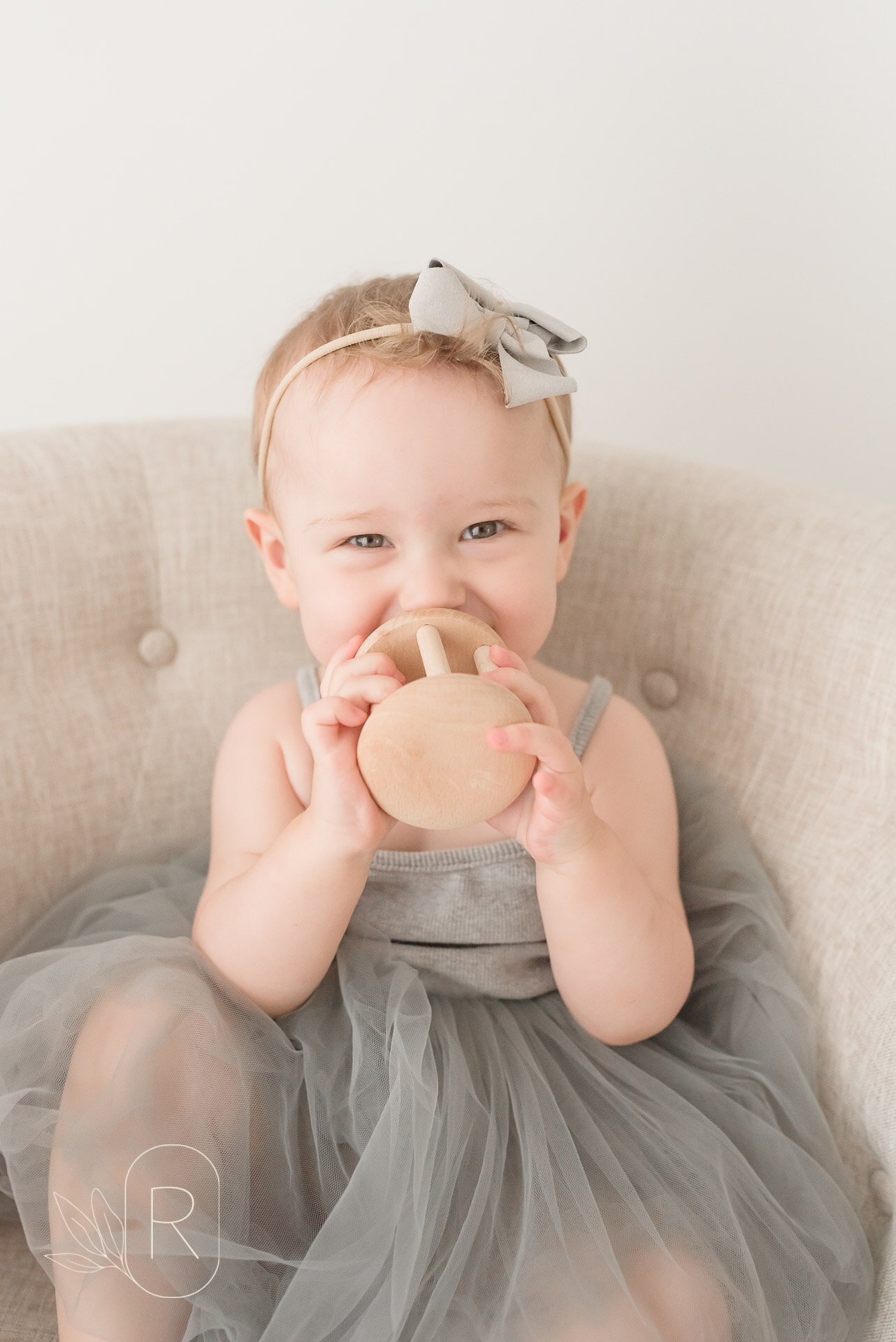 baby with wooden toy