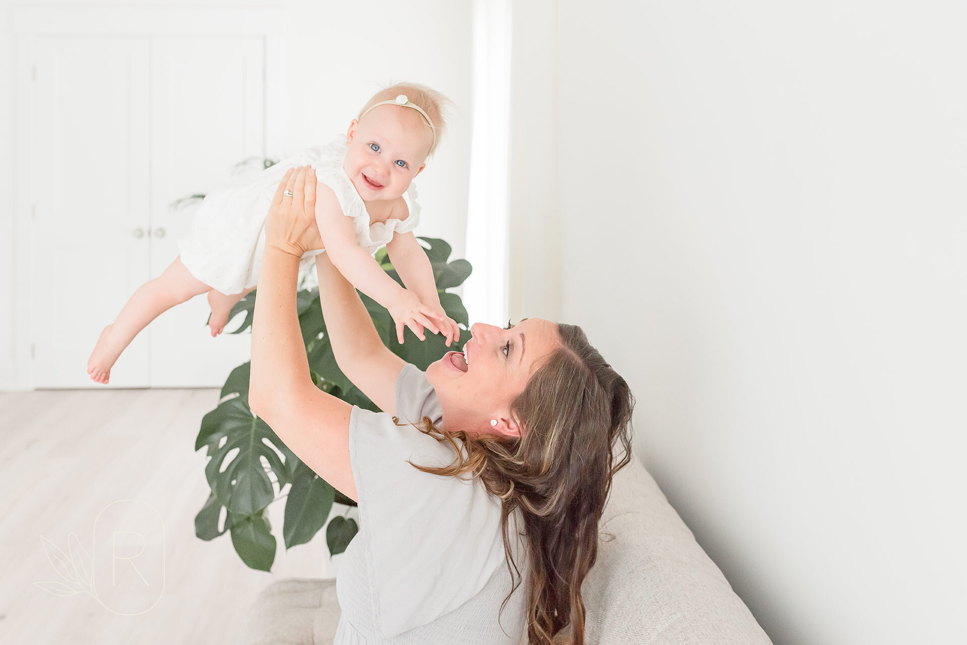 mom-lifting-baby-into-air-fun-family-photography-for-babies-grimsby-ontario.jpg