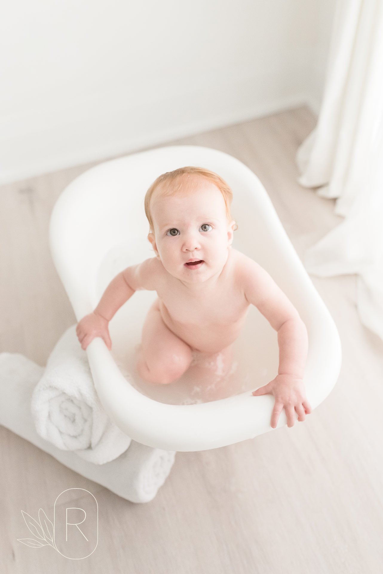 Baby girl looking at the camera in the bubble bath Niagara Ontario photo studio