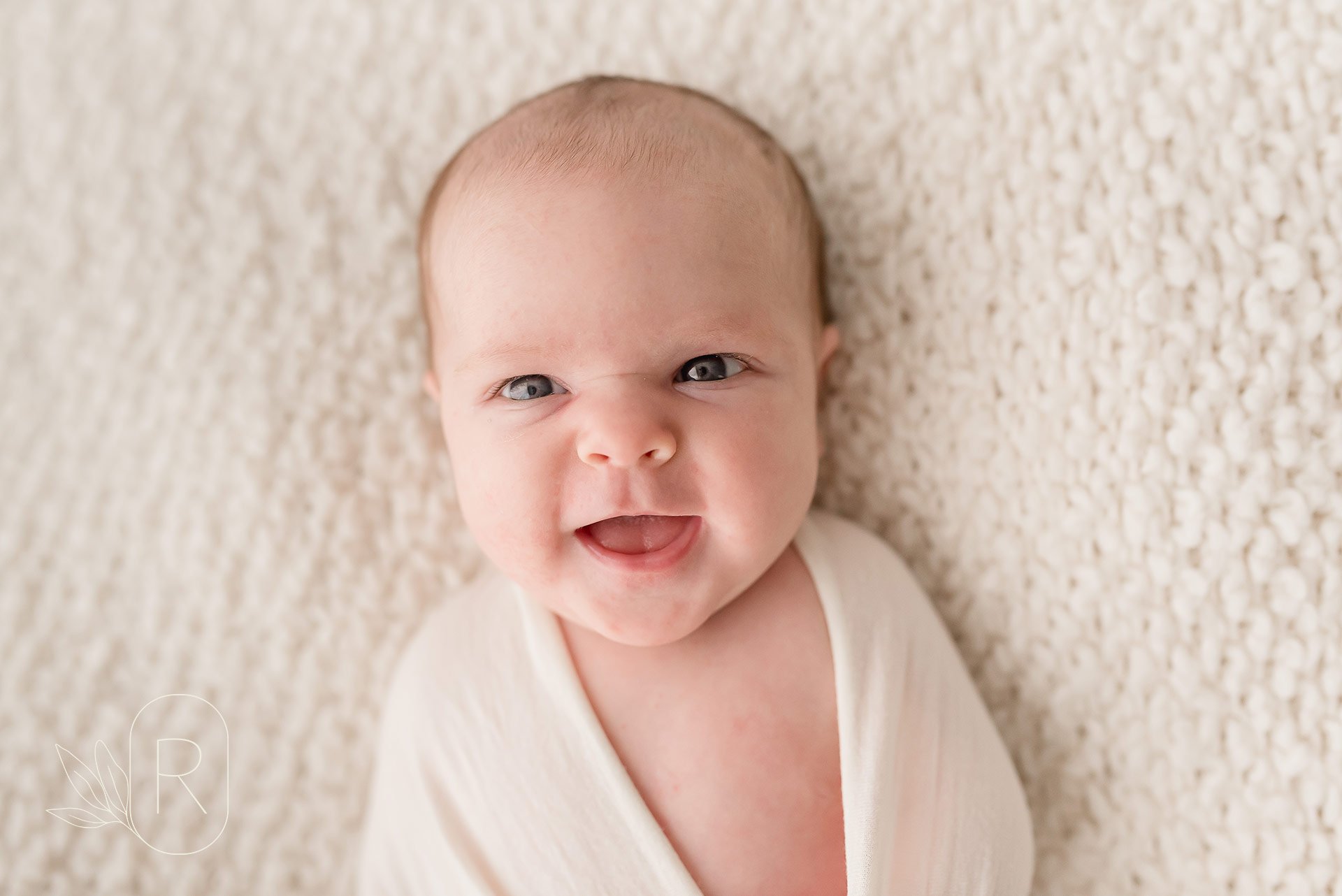 smiling-newborn-swaddled-baby-little-moments-family-photography-Reflections-niagara-ontario.jpeg