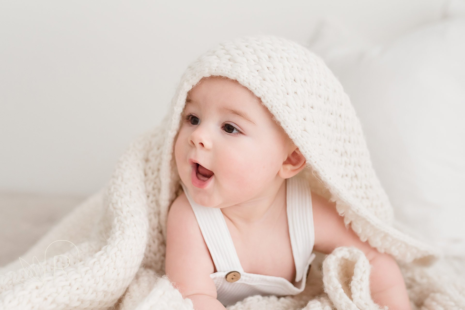 three-month-old-baby-girl-playing-blanket-Reflections-photography-niagara-ontario.jpeg