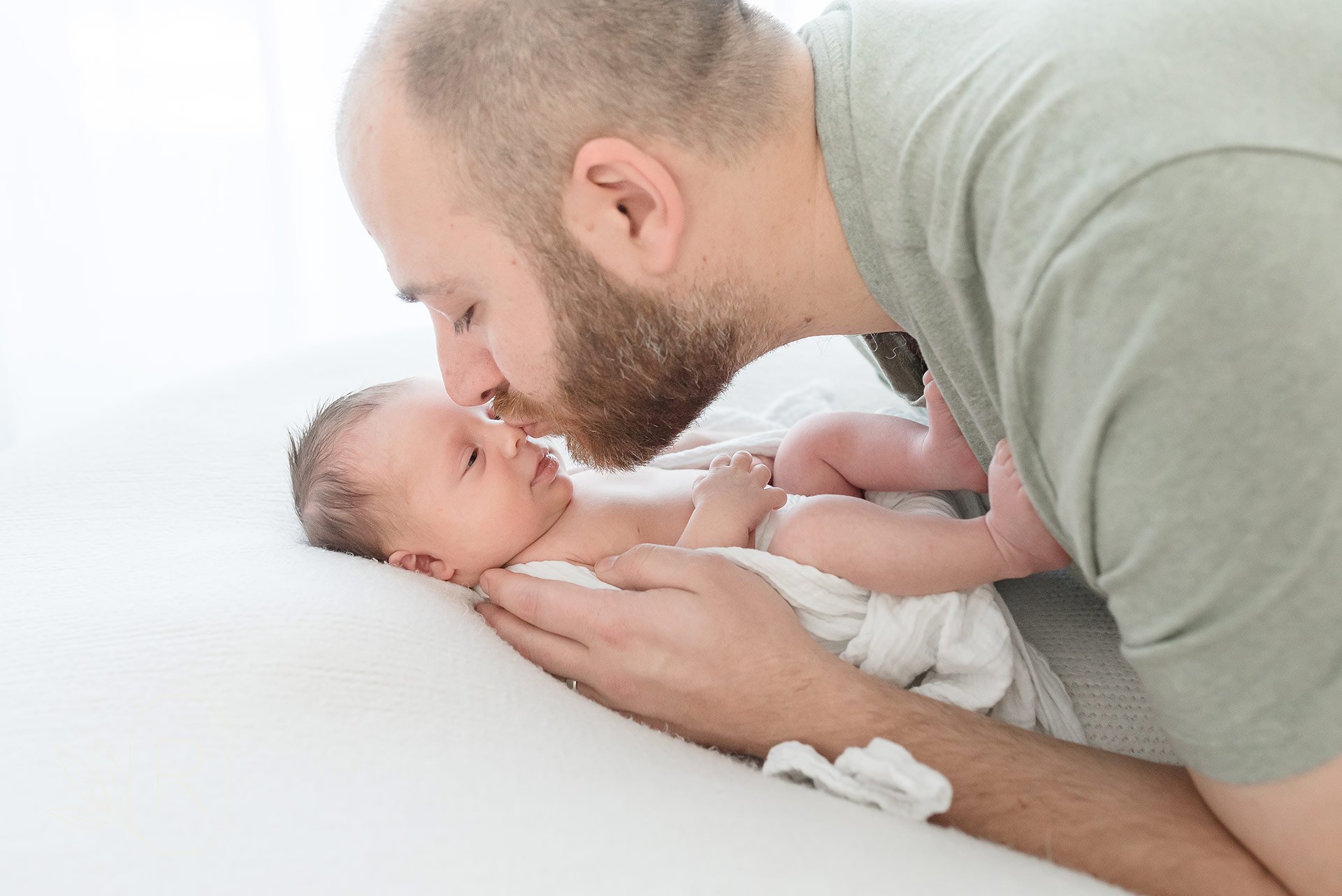 dad-and-newborn-candid-kisses-reflections-family-photography-niagara-ontario.jpeg