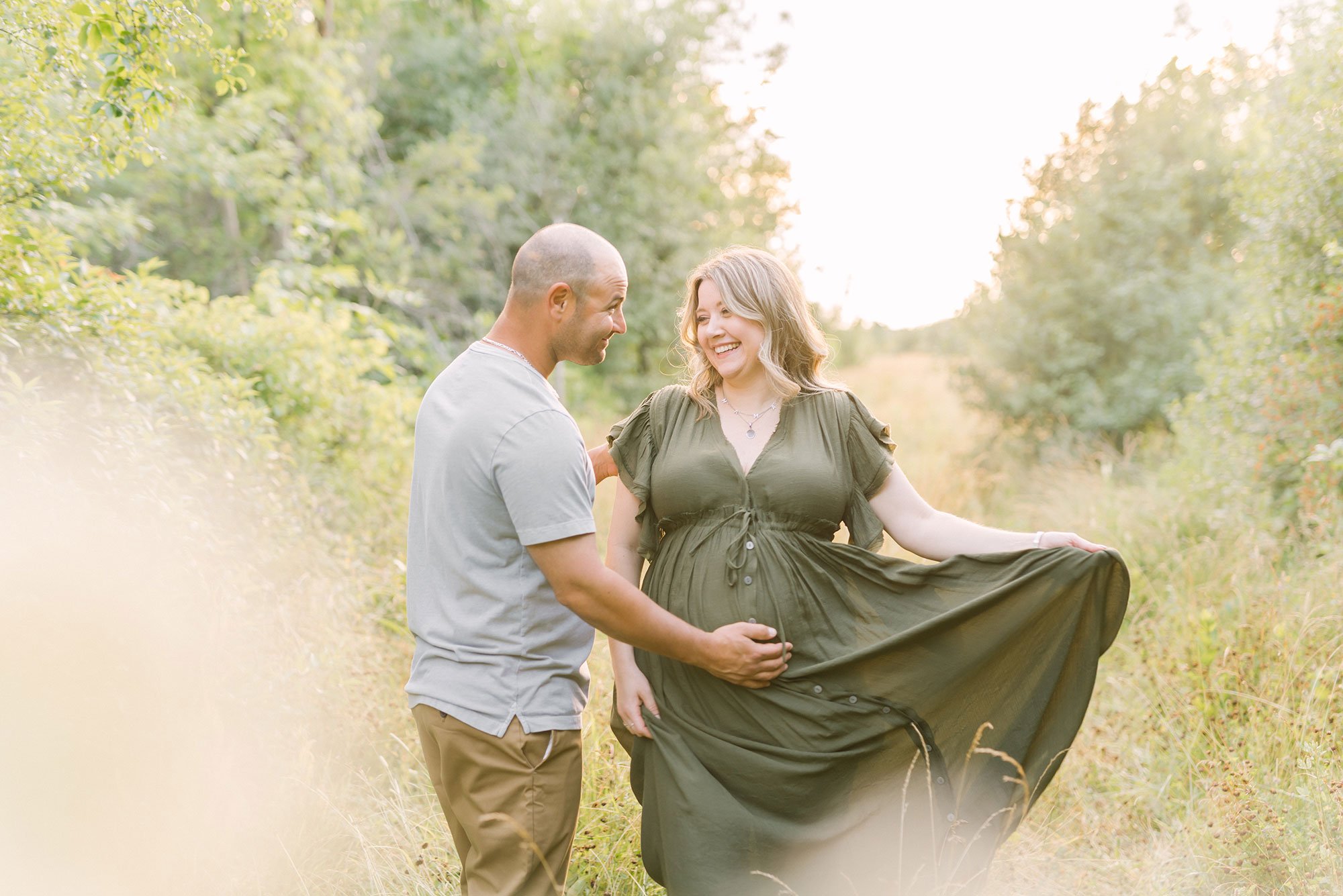 Maternity photography in Hamilton, Ontario, Pregnant mom looking at happy husband as he smiles at her (Copy)